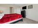 Bright bedroom with a comfortable bed, dresser, and large window at 5600 Siltstone St, Lakeland, FL 33811
