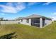 Home with fenced backyard, hot tub, and screened enclosure at 5600 Siltstone St, Lakeland, FL 33811