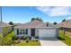 One-story home with a two-car garage and landscaped yard at 5600 Siltstone St, Lakeland, FL 33811