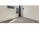 Well-lit bedroom with carpeted floors and window at 5600 Siltstone St, Lakeland, FL 33811