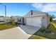 One story home with a two car garage and manicured lawn at 5600 Siltstone St, Lakeland, FL 33811