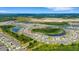 Aerial view of a house nestled beside a lake in a community at 5600 Siltstone St, Lakeland, FL 33811