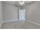 Cozy bedroom featuring grey walls, carpet flooring and ceiling fan at 401 Sw 1St Ave, Mulberry, FL 33860