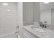 Modern bathroom with white subway tile, marble vanity, and updated fixtures at 401 Sw 1St Ave, Mulberry, FL 33860