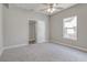Charming bedroom with grey walls, carpet flooring, and ceiling fan at 401 Sw 1St Ave, Mulberry, FL 33860