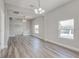 Spacious living room showcasing hardwood floors and large windows at 401 Sw 1St Ave, Mulberry, FL 33860