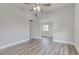 Spacious bedroom with hardwood floors and ceiling fan at 401 Sw 1St Ave, Mulberry, FL 33860
