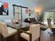 Open living room showcasing a brown leather sofa and barn door at 4330 Old Colony Rd, Mulberry, FL 33860