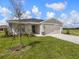 One-story home with attached garage and front yard at 2097 Summerlake Dr, Auburndale, FL 33823