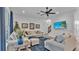 Comfortable living room with sectional sofa and a view of the staircase at 7365 Millbrook Oaks Dr, Lakeland, FL 33813