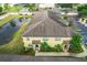 Aerial view of townhouses with pond and parking at 519 Sandstone St, Lakeland, FL 33809