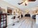 Open living area with hardwood floors, a fireplace, and comfortable seating at 519 Sandstone St, Lakeland, FL 33809