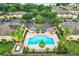 Community pool with patio and surrounding townhomes at 519 Sandstone St, Lakeland, FL 33809