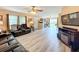 Open living space with hardwood floors, a view of the backyard and kitchen at 519 Sandstone St, Lakeland, FL 33809