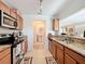 Open kitchen featuring granite countertops and stainless steel appliances at 519 Sandstone St, Lakeland, FL 33809