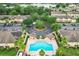 Community pool with patio and surrounding townhomes at 519 Sandstone St, Lakeland, FL 33809