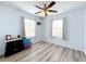 Spacious bedroom with ceiling fan and wood-look flooring at 519 Sandstone St, Lakeland, FL 33809