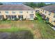 Aerial view of townhouses, showing backyard and pond at 519 Sandstone St, Lakeland, FL 33809