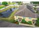 Aerial view of a townhome community with pond views at 519 Sandstone St, Lakeland, FL 33809