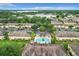 Aerial view of community with pool and lake nearby at 519 Sandstone St, Lakeland, FL 33809