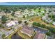 Aerial view showcasing a community with houses, roads, and a golf course at 519 Sandstone St, Lakeland, FL 33809
