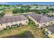 Aerial view of townhouses with backyard and pond at 519 Sandstone St, Lakeland, FL 33809