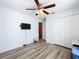 Bright bedroom with ceiling fan, vinyl flooring, and closet at 519 Sandstone St, Lakeland, FL 33809