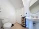 Clean bathroom with pedestal sink and updated flooring at 519 Sandstone St, Lakeland, FL 33809