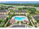 Community pool with lounge chairs and surrounding patio at 519 Sandstone St, Lakeland, FL 33809