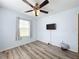 Well-lit bedroom with ceiling fan and vinyl plank flooring at 519 Sandstone St, Lakeland, FL 33809