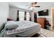 Spacious bedroom with large bed, ceiling fan, and ample closet space at 519 Sandstone St, Lakeland, FL 33809