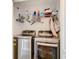 Convenient laundry room with LG washer and dryer, and overhead shelving at 519 Sandstone St, Lakeland, FL 33809