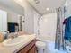Bathroom with a tub, shower, single sink vanity, and a toilet at 519 Sandstone St, Lakeland, FL 33809