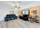 Living area with hardwood floors, comfortable seating, and lots of natural light at 519 Sandstone St, Lakeland, FL 33809