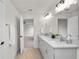 Double vanity bathroom with marble countertop and grey cabinets at 840 Voight N Ave, Fort Meade, FL 33841