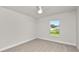 Bright bedroom with carpet flooring and a window at 840 Voight N Ave, Fort Meade, FL 33841