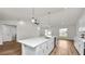 Modern kitchen with white cabinets, stainless steel appliances and island at 840 Voight N Ave, Fort Meade, FL 33841