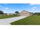 New home featuring a large two-car garage and a spacious driveway at 840 Voight N Ave, Fort Meade, FL 33841