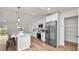 Modern kitchen with white cabinets, stainless steel appliances, and an island at 840 Voight N Ave, Fort Meade, FL 33841
