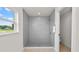 Large walk-in shower with grey tile and marble base at 840 Voight N Ave, Fort Meade, FL 33841