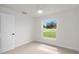 Spacious bedroom with a window, ceiling fan, and closet at 840 Voight N Ave, Fort Meade, FL 33841