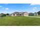 Newly constructed home with a beige exterior and a two-car garage at 840 Voight N Ave, Fort Meade, FL 33841