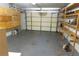Spacious garage with built-in shelving and ample storage at 1058 Penguin Pl, Lakeland, FL 33809