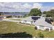 Aerial view of the house, showcasing the lake view and solar panels at 152 Audubon Ct, Winter Haven, FL 33884