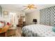 Comfortable bedroom with a charming bed and built-in dresser at 152 Audubon Ct, Winter Haven, FL 33884