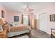 Bright bedroom with a queen-size bed, dresser, and large window at 152 Audubon Ct, Winter Haven, FL 33884