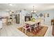 Bright dining area adjacent to the kitchen with a charming table at 152 Audubon Ct, Winter Haven, FL 33884