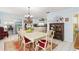 Elegant dining room with a large table and view of kitchen at 152 Audubon Ct, Winter Haven, FL 33884