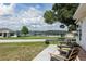 Relaxing patio furniture overlooking a peaceful lake view at 152 Audubon Ct, Winter Haven, FL 33884