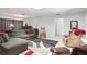 Spacious living room featuring a comfortable sectional sofa and relaxing armchairs at 152 Audubon Ct, Winter Haven, FL 33884